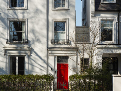front-view-front-door-with-white-wall-plants